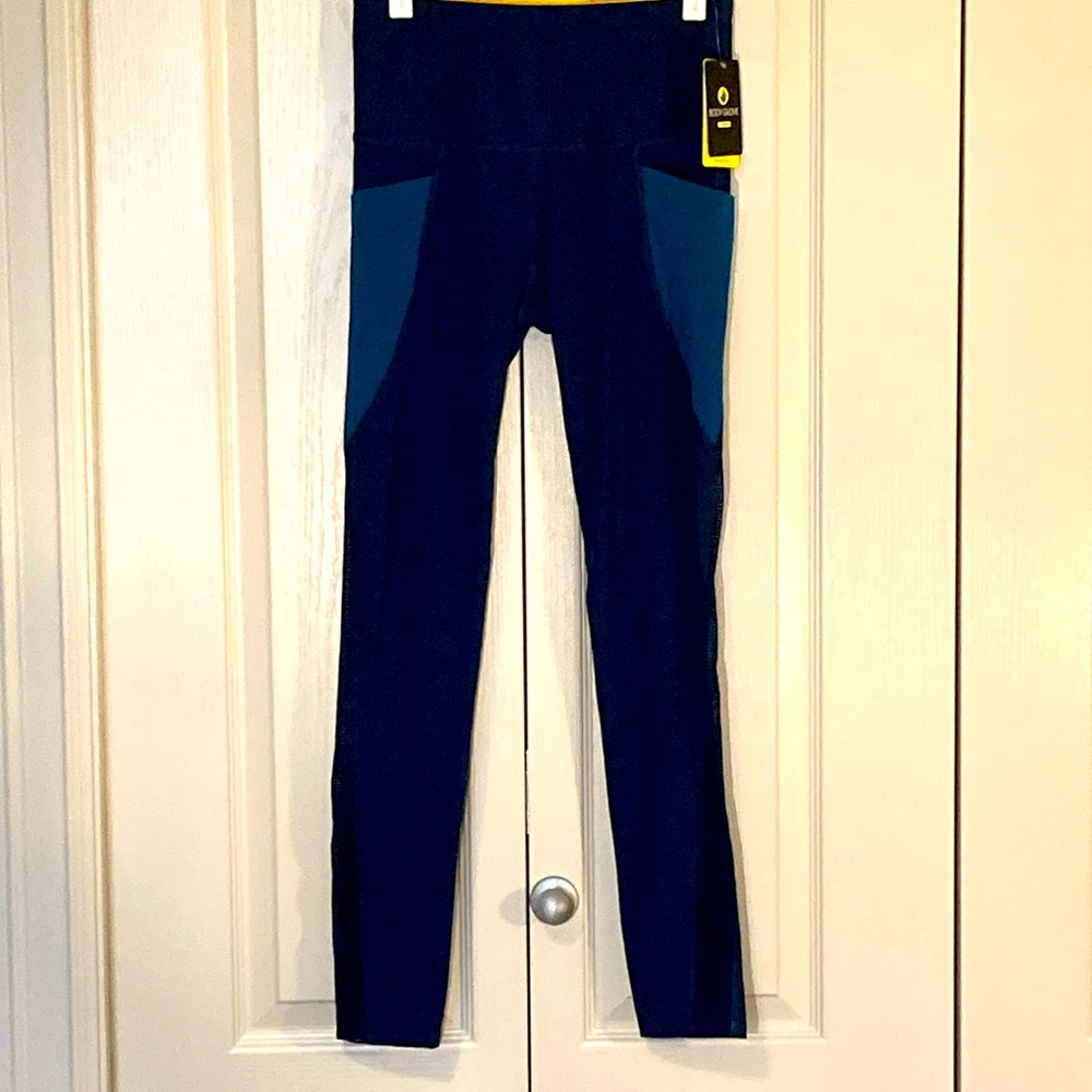 BNWT. Body Glove 2 tone teal &dark blue mesh legging with pockets. Size …